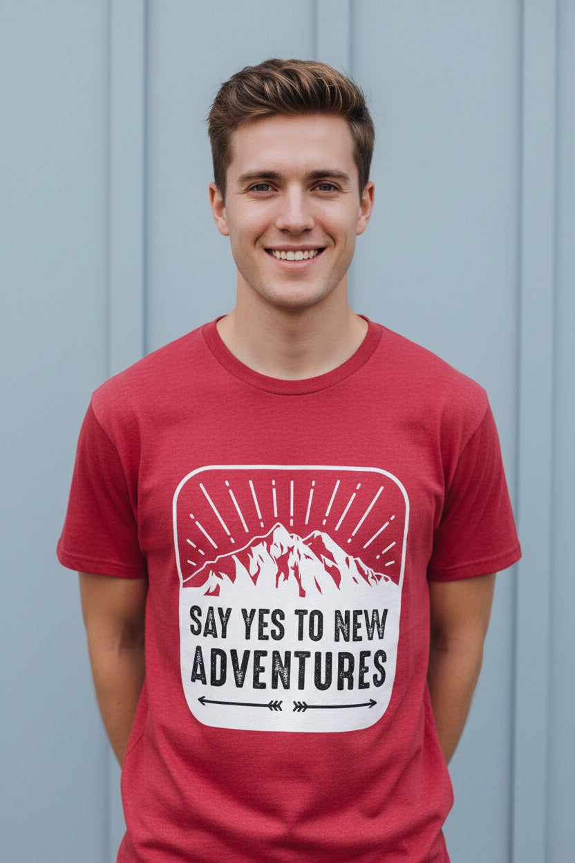 Red t-shirt with a mountain graphic and 'Say Yes to New Adventures' text on a white background