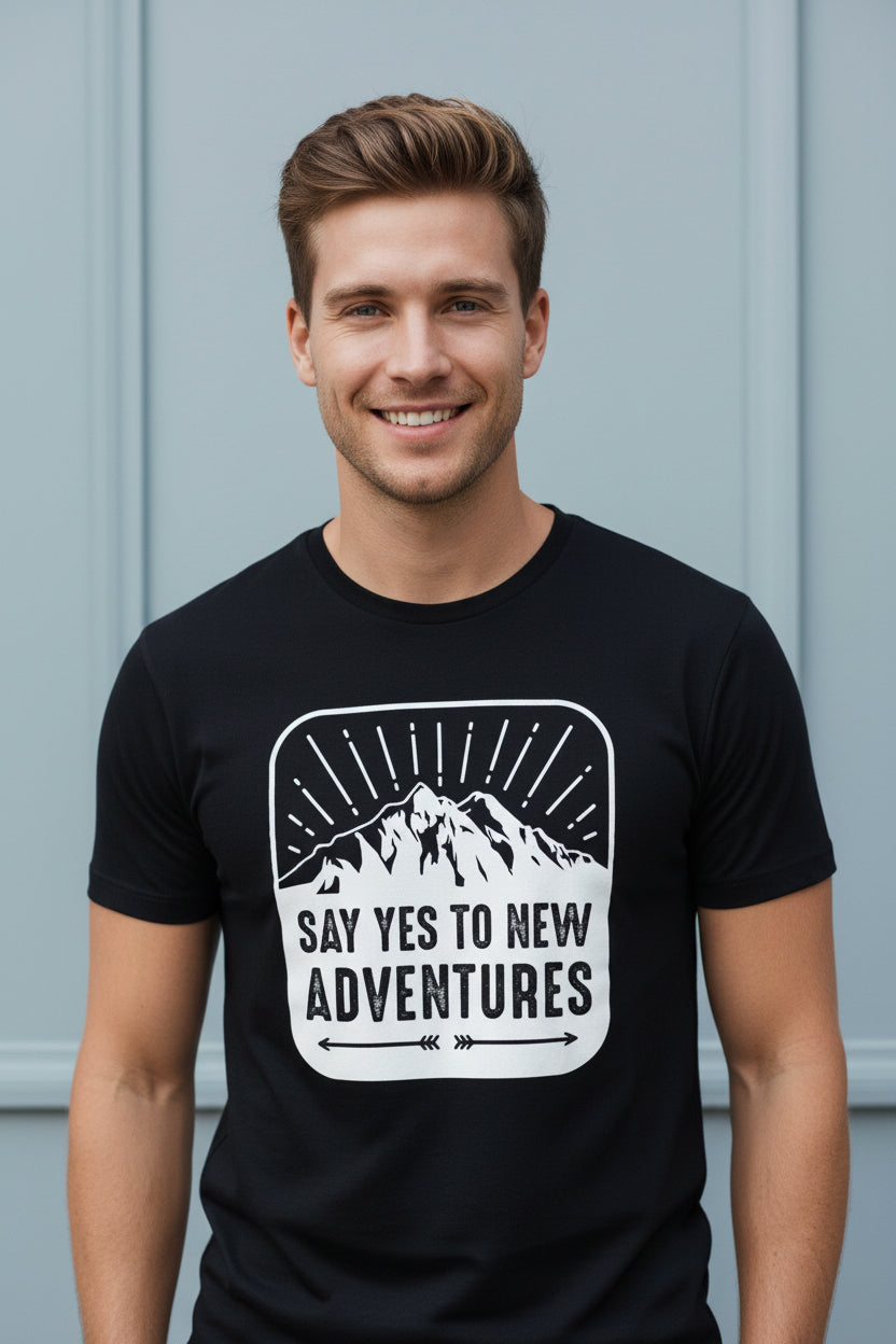 Black t-shirt with mountain graphic and 'Say Yes to New Adventures' text on a white background