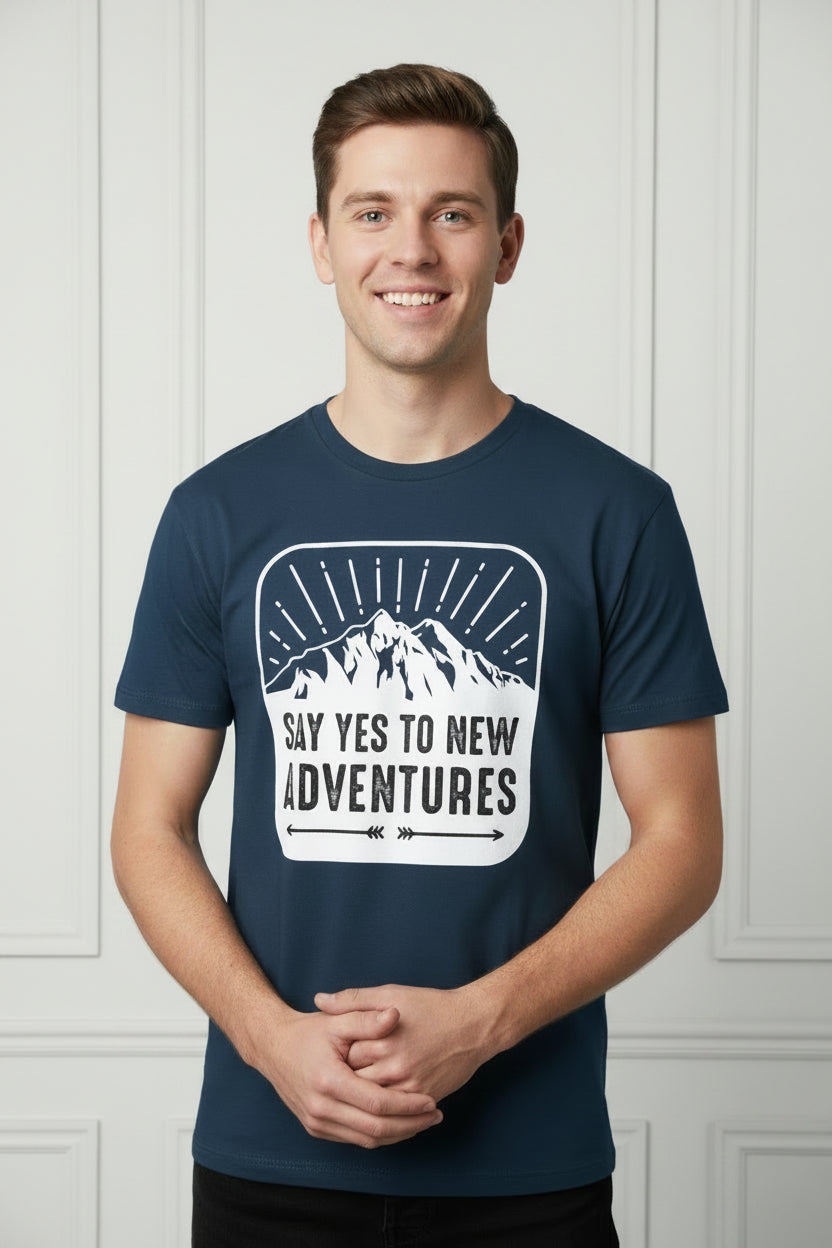 Navy blue t-shirt with mountain graphic and 'Say Yes to New Adventures' text on a white background