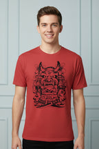 Red t-shirt with black graphic design of a mask worn by a person on a white background